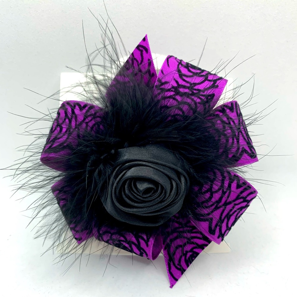 Child’s handmade hair-bow with feathers